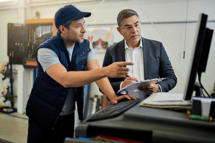 managed-it-services Technician providing IT support for smooth manufacturing operations.